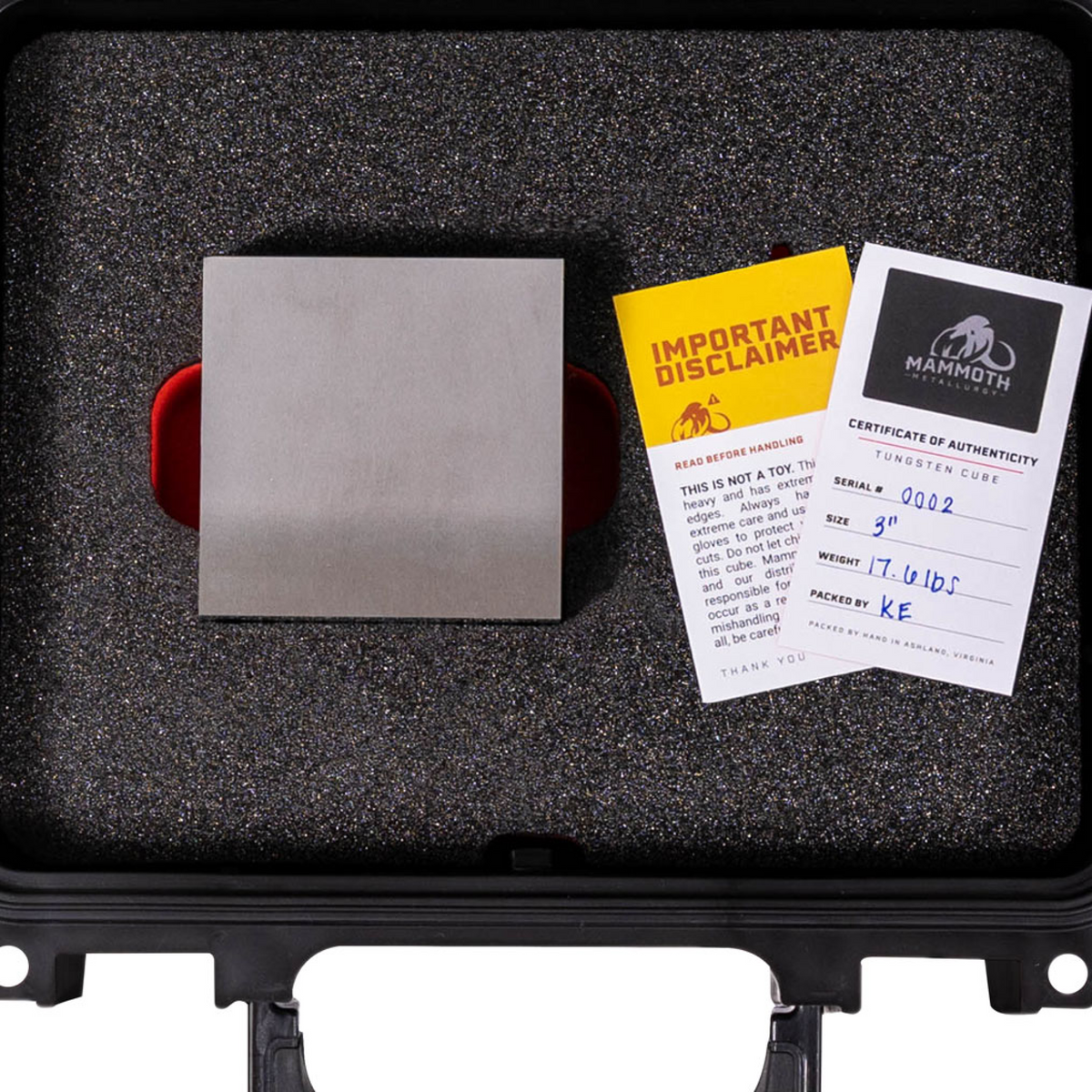 3 inch tungsten cube inside Mammoth Metallurgy case with disclaimer cards